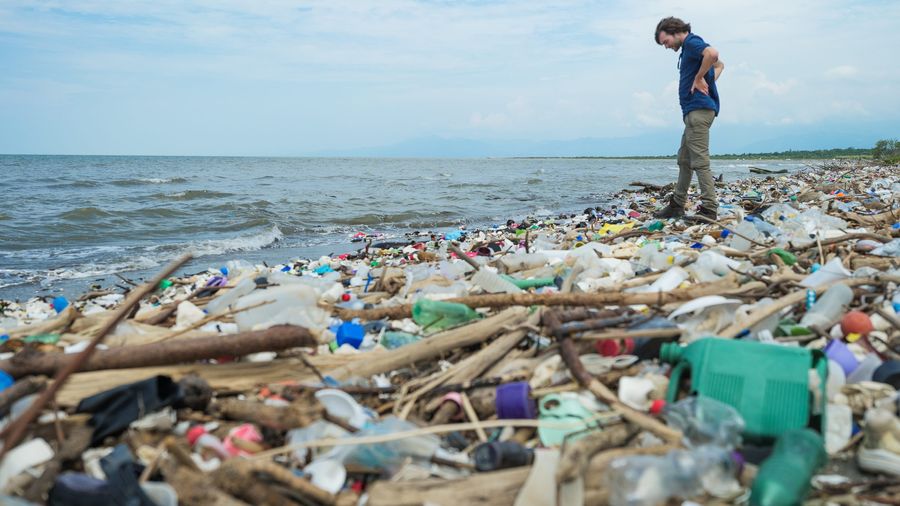 Boyan Slat, founder and CEO of The Ocean Cleanup on a polluted beach in Honduras